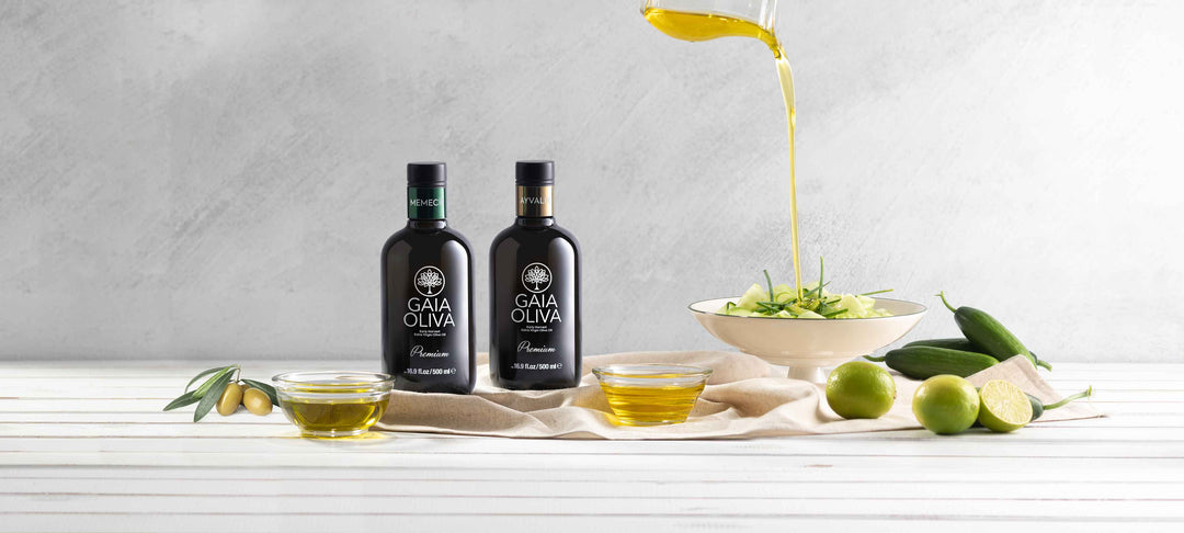 Bottles of early harvest olive oil beside a salad, showcasing the essence of fresh ingredients and flavors, WHAT IS EARLY HARVEST OLIVE OIL.
