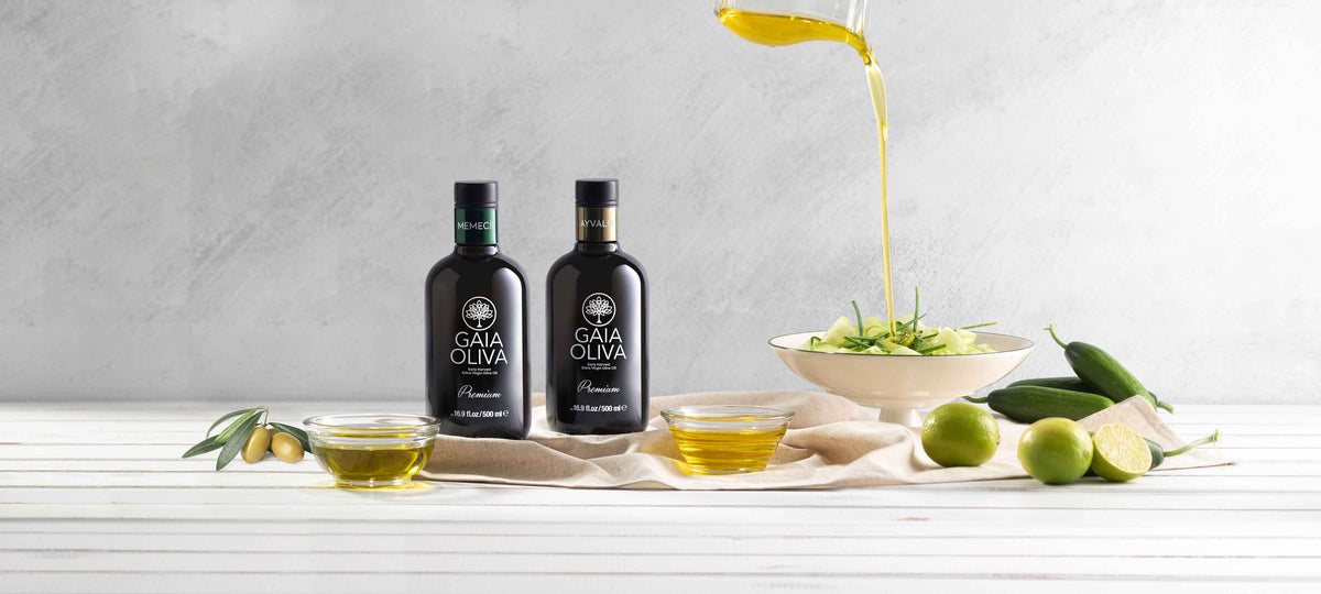 Bottles of early harvest olive oil beside a salad, showcasing the essence of fresh ingredients and flavors, WHAT IS EARLY HARVEST OLIVE OIL.