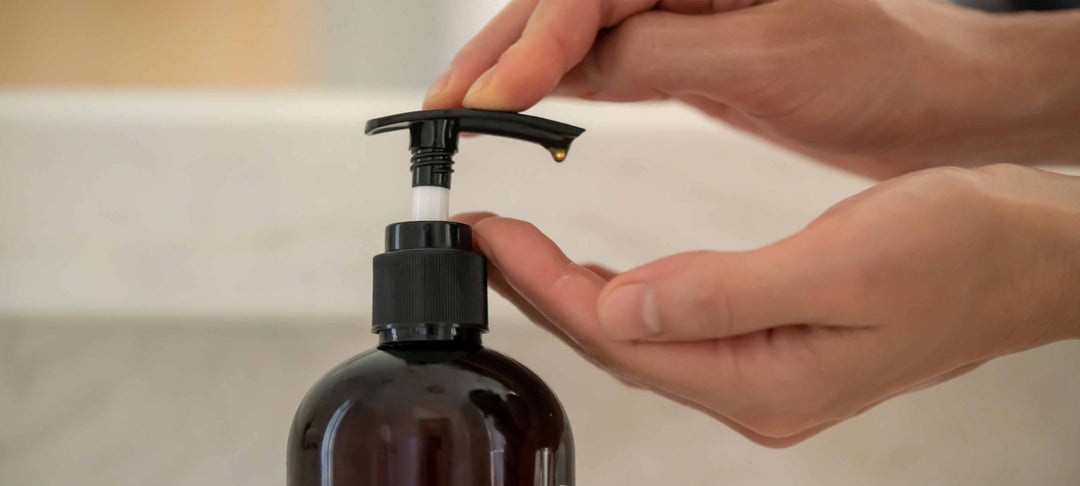 Person demonstrating how to choose a liquid hand soap by using a pump bottle.