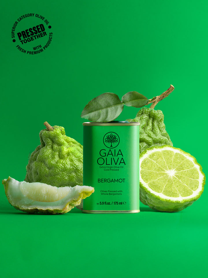 a tin of Bergamot Extra Virgin Olive Oil with fresh bergamots