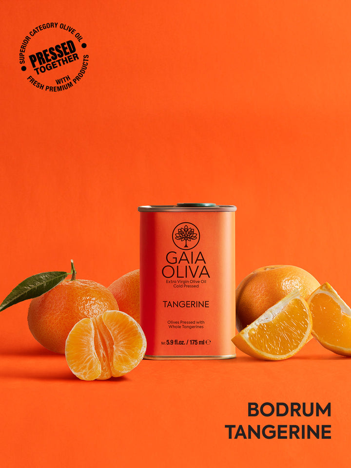 a tin of Tangerine Extra Virgin Olive Oil with fresh tangerines