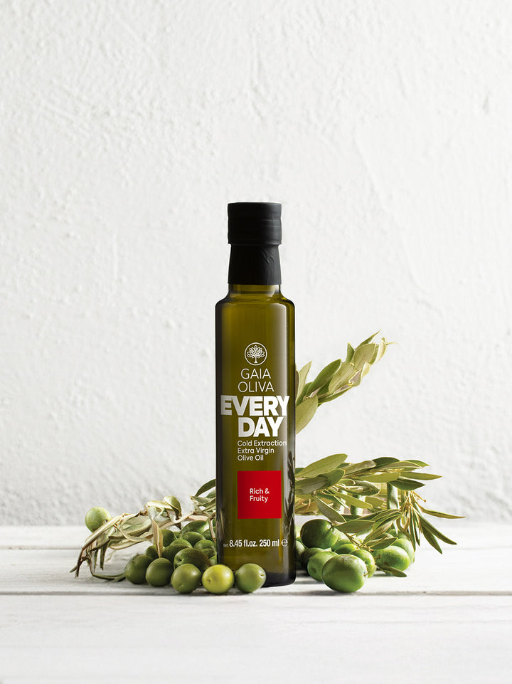 250 ml bottle of Everyday extra virgin olive oil with green olives on a white background