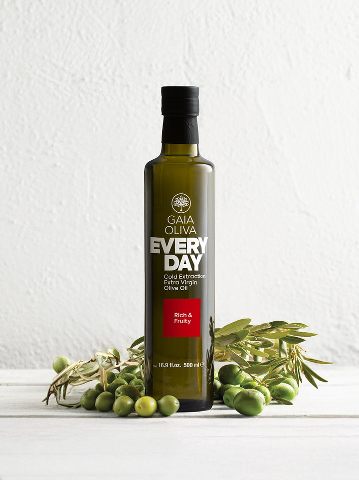 Everyday Extra Virgin Olive Oil with olives on a white background