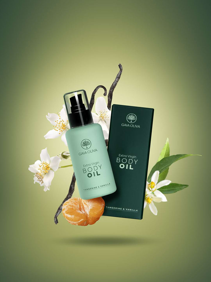 a bottle of Gaia Oliva Extra Virgin Body Oil with fresh tangerine and and vanilla folower.