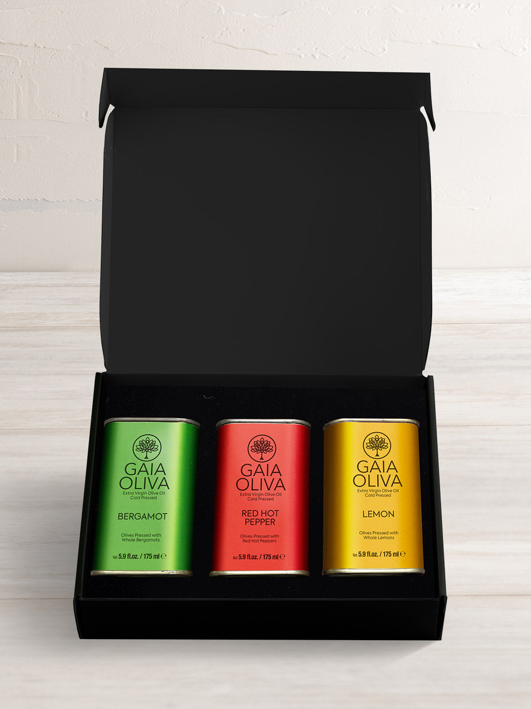 Extra Virgin Olive Oil Gift Set with tin of hot pepper, lemon and bergamot olive oil in a black gift box