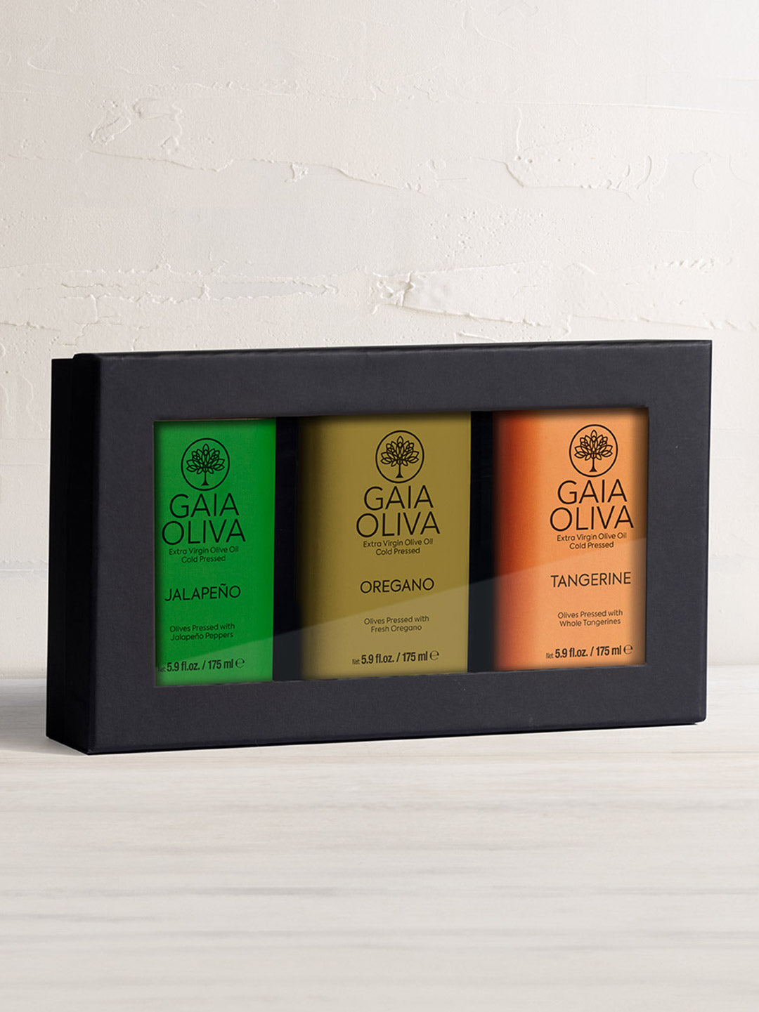 Extra Virgin Olive Oil Gift Set featuring tangerine, oregano, and jalapeño flavored oils in black box..