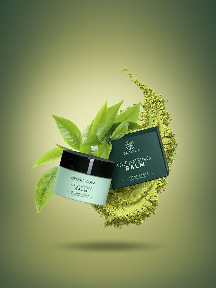 a jar of olive oil cleansing balm with fresh matcha powder and and leafs
