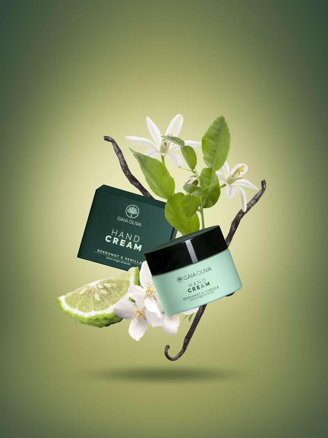 a jar of olive oil hand cream with fresh bergamot friut and fanilla flower , green background.